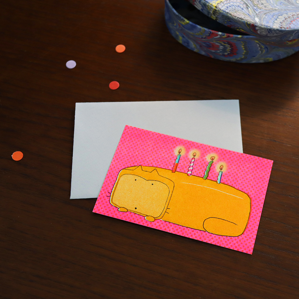 「OrangePoundCakeCard」うれしい出来事を祝うオレンジパウンドケーキの猫カード。蛍光カラーが魅力的なリソ印刷カードです。