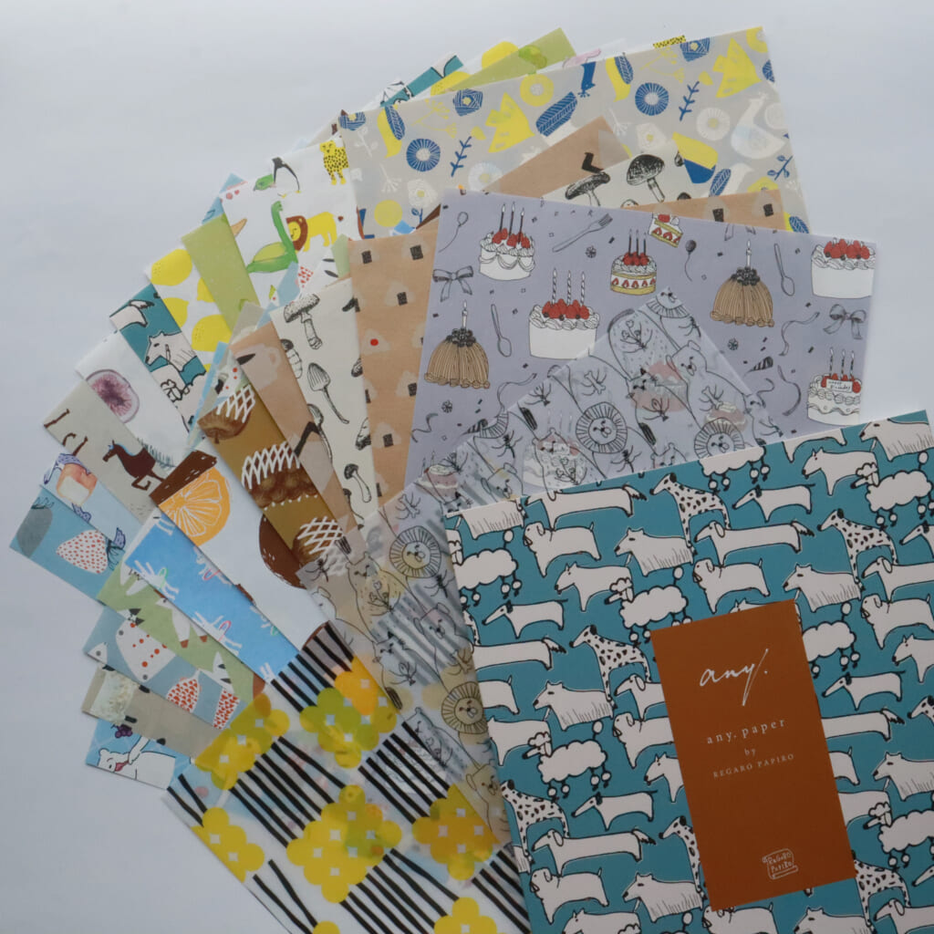 「包装紙ハーフサイズ24枚セット・アニマル／フードセレクション」動物や食べ物に関する24枚の包装紙を集めたペーパーセットです。オリジナルの紙製ファイル入り。